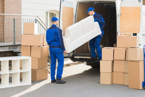 Removal team handling a move from a Pimlico flat with stairs