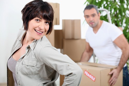 Business relocation process with labelled boxes and office equipment