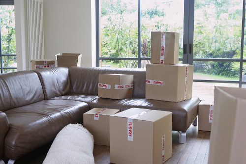 Packed household boxes ready for transport in a Pimlico property